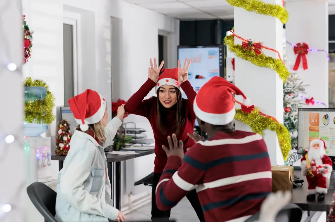 Browse By Activity 5 office employees taking part in Festive team activities