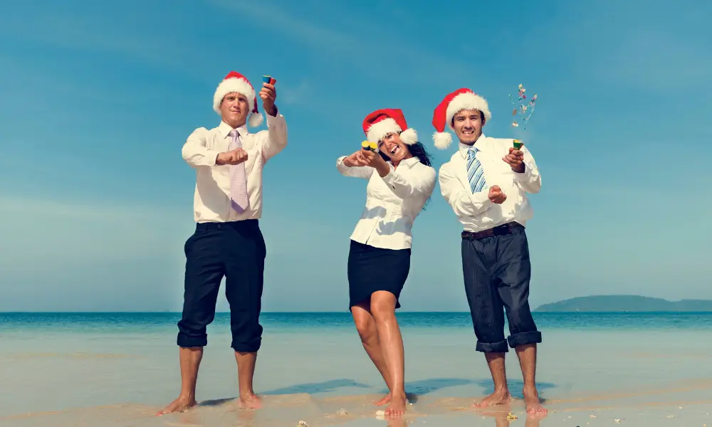 In-Person GPS Games 8 corporate team racing on the beach with Christmas hats